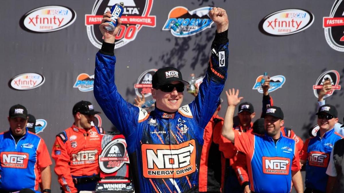 Kyle Busch celebrates in Victory Lane after winning Saturday’s NASCAR XFINITY Series Axalta Faster. Tougher. Brighter. 200 at Phoenix International Raceway.