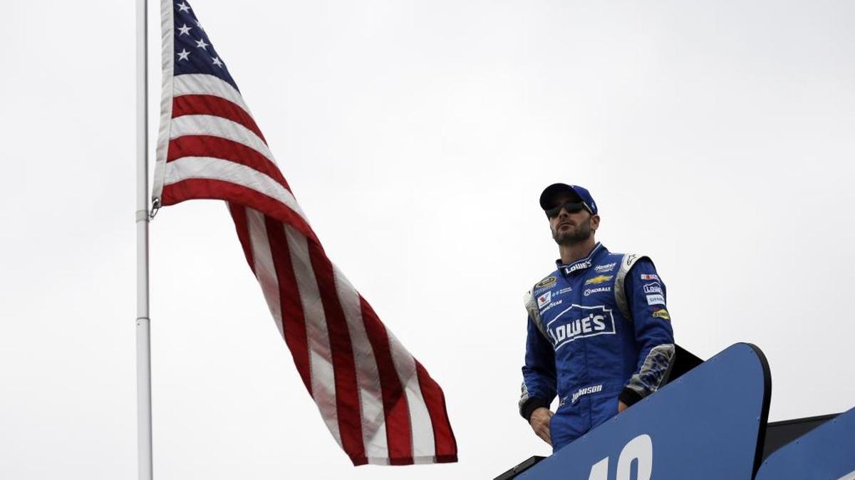 
Jimmie Johnson looks to the track during Friday’s practice for the NASCAR Sprint Cup Series auto race at Chicagoland Speedway in Joliet, Ill. 
