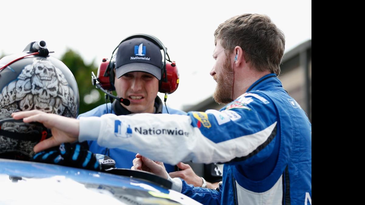 
Dale Earnhardt Jr. right, talks with crew chief Greg Ives on the grid prior to qualifying for the NASCAR Sprint Cup Series FedEx 400 Benefiting Autism Speaks at Dover International Speedway on May 29, 2015 in Dover, Del.
