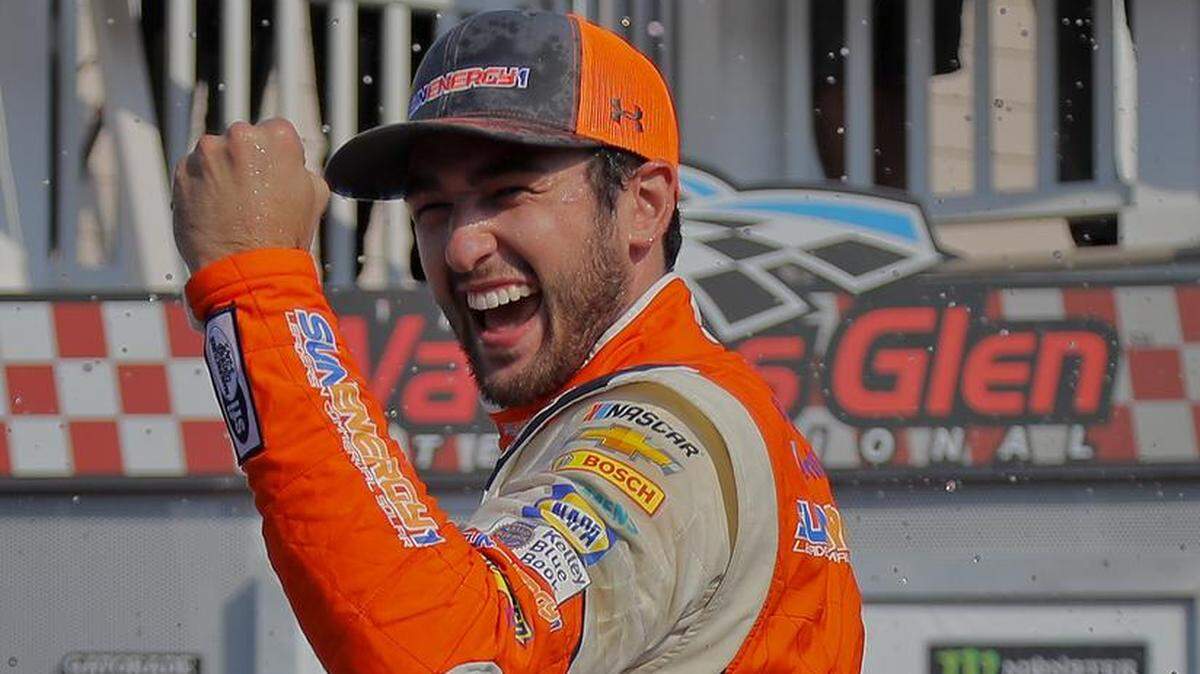 Chase Elliott celebrates after winning a NASCAR Cup Series auto race, Sunday, Aug. 5, 2018, in Watkins Glen, N.Y. (AP Photo/Julie Jacobson)
