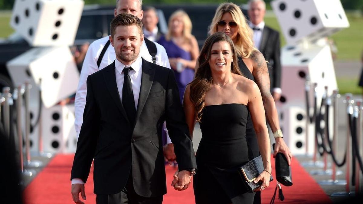 NASCAR drivers Ricky Stenhouse Jr. and Danica Patrick walk the red carpet at the “Catwalk for a Cause” charity event at the Statesville Municipal Airport this past May.