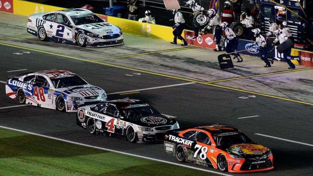 NASCAR Sprint Cup Series driver Martin Truex Jr. leads Kevin Harvick (4) and Jimmie Johnson (48) down pit road for their final pit stop of the Coca-Cola 600 as driver Brad Keselowski (2) pits at Charlotte Motor Speedway on Sunday, May 29, 2016.