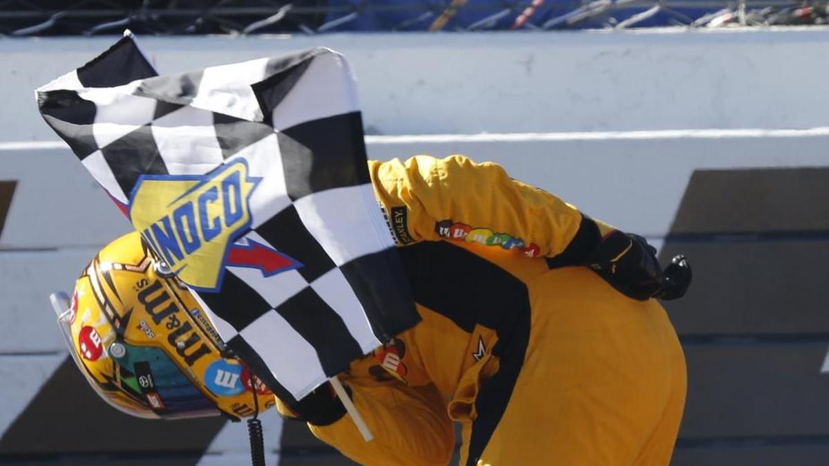 Kyle Busch takes a bow as he celebrates winning the April 2016 Cup race at Martinsville Speedway.