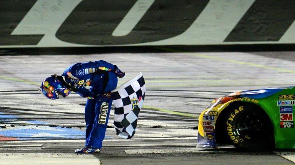 Kyle Busch bows to the cheers of the fans after winning Saturday’s NASCAR All-Star Race at Charlotte Motor Speedway in Concord.