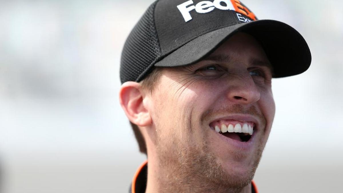 Denny Hamlin, driver of the #11 FedEx Express Toyota, looks on during qualifying for the NASCAR Sprint Cup Series Daytona 500 at Daytona International Speedway on February 14, 2016 in Daytona Beach, Florida.
