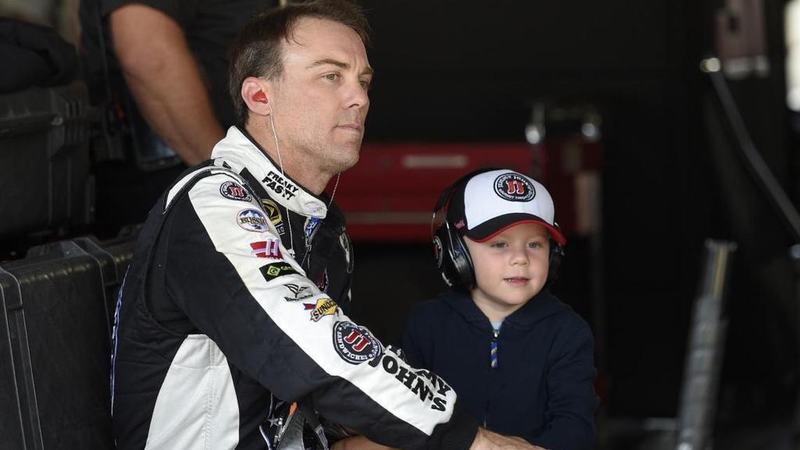 Kevin Harvick, left, looks on in the garage during Cup practice with his son Keelan, right, on May 14 at Dover International Speedway. Harvick Harvick is in the midst of his third season with Stewart-Haas and wants to race for 4 to 5 years more.
