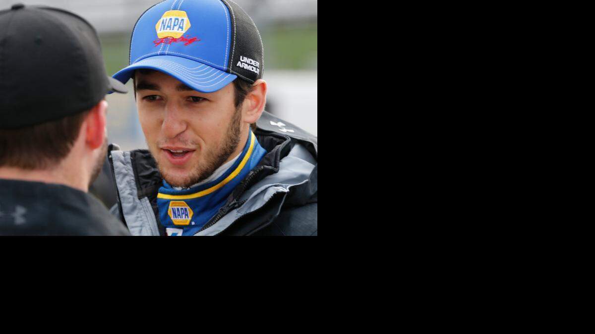 
Sprint Cup driver Chase Elliott talks to a crew member prior to qualifying at the Martinsville Speedway in Martinsville, Va., Friday, March 27, 2015.
