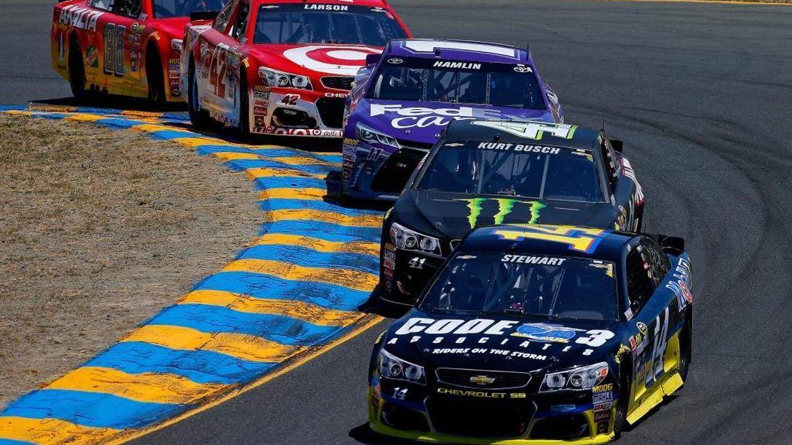 Tony Stewart, driver of the #14 Code 3 Assoc/Mobil 1 Chevrolet, leads a pack of cars during the NASCAR Sprint Cup Series Toyota/Save Mart 350 at Sonoma Raceway on June 26, 2016 in Sonoma, California.
