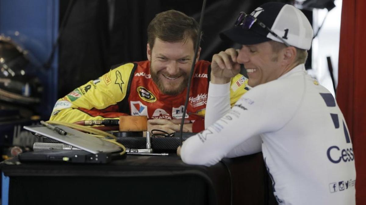 Dale Earnhardt Jr., left, and Jamie McMurray laugh during a practice session for Sunday's NASCAR Sprint Cup Series auto race, Friday in Long Pond, Pa.