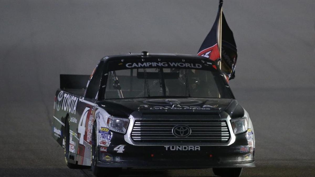 Erik Jones celebrates with a burnout after winning the NASCAR’s Truck series championship at Homestead-Miami Speedway on Friday night.