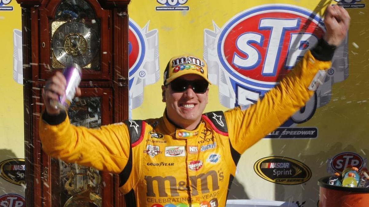 Kyle Busch celebrates after winning Sunday’s STP 500 Sprint Cup auto race at Martinsville Speedway.