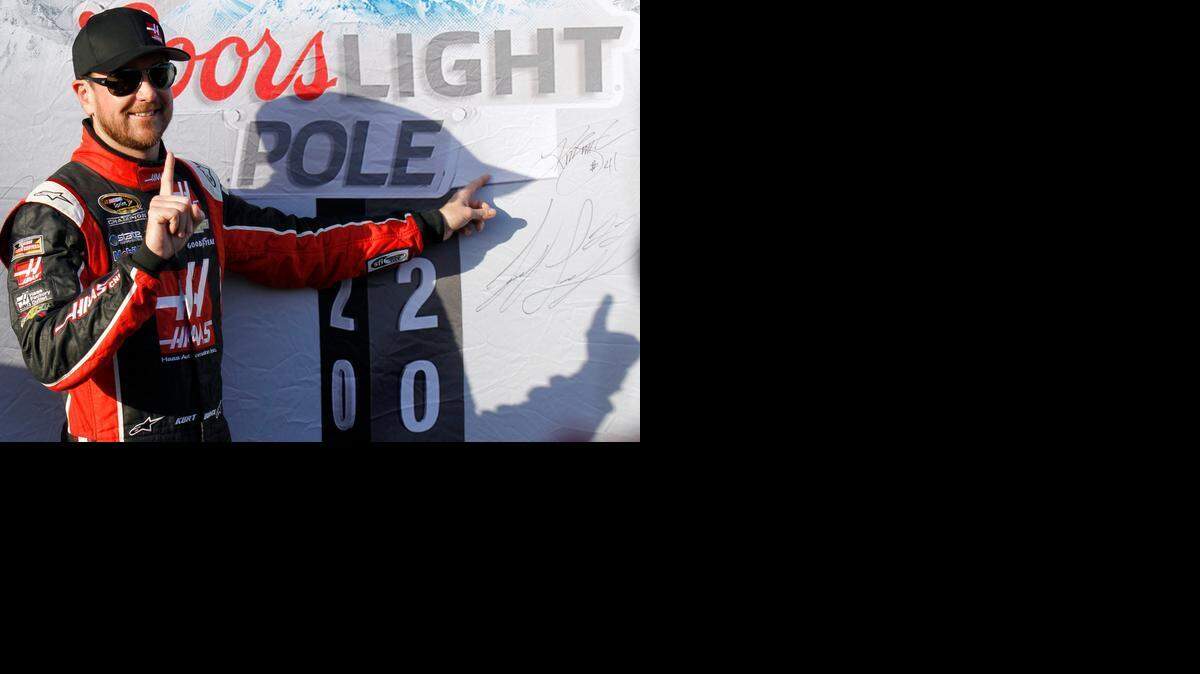 
Driver Kurt Busch poses after winning the pole for Sunday's NASCAR Sprint Cup Series auto race in Fontana, Calif., Friday, March 20, 2015. 
