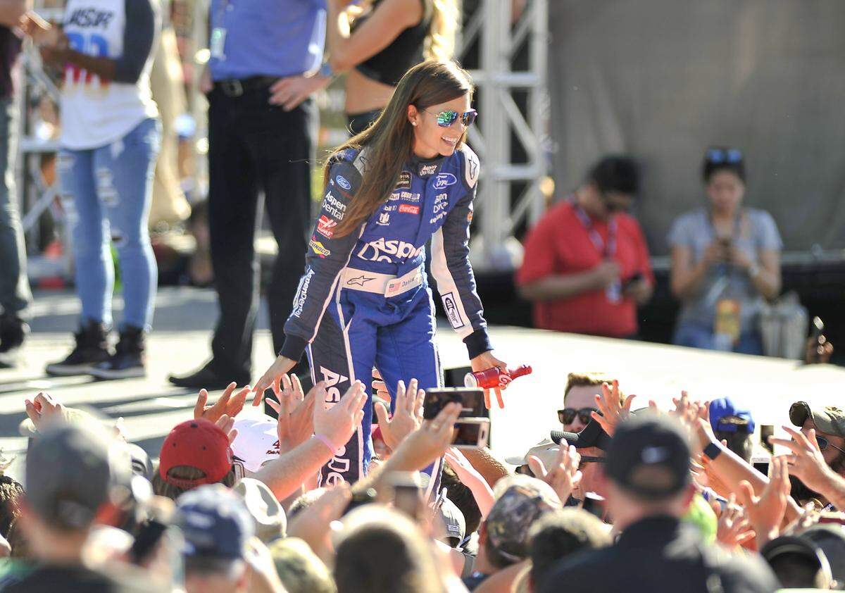 Danica Patrick. greets fans as she is introduced before a NASCAR Cup Series auto race at Homestead-Miami Speedway in Homestead, Fla., Sunday, Nov. 19, 2017. (AP Photo/Gaston De Cardenas)