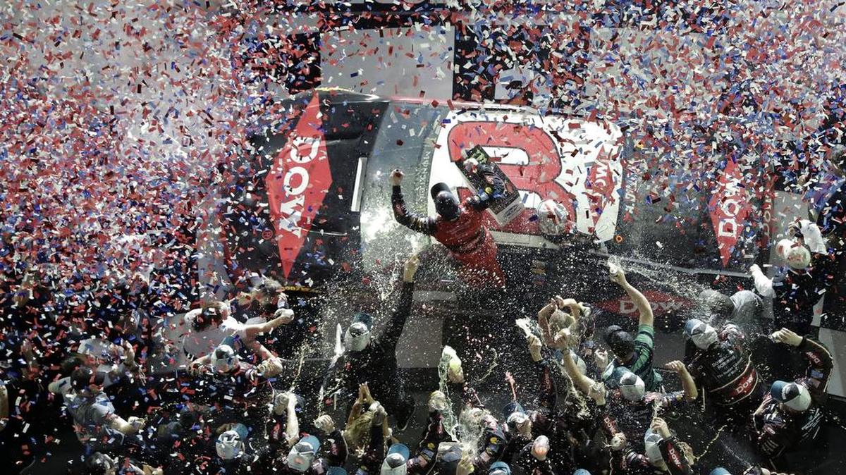 Austin Dillon, center, celebrates on his car with crew members in Victory Lane after winning the NASCAR Daytona 500 auto race at Daytona International Speedway, Sunday, Feb. 18, 2018, in Daytona Beach, Fla. (AP Photo/John Raoux)