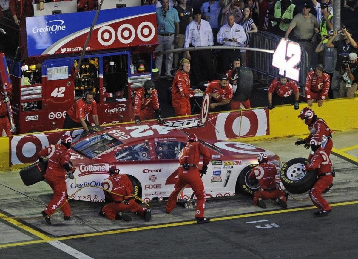 Crew members perform a pit stop on Kyle Larson's car during Saturday’s NASCAR All-Star Race at Charlotte Motor Speedway in Concord.