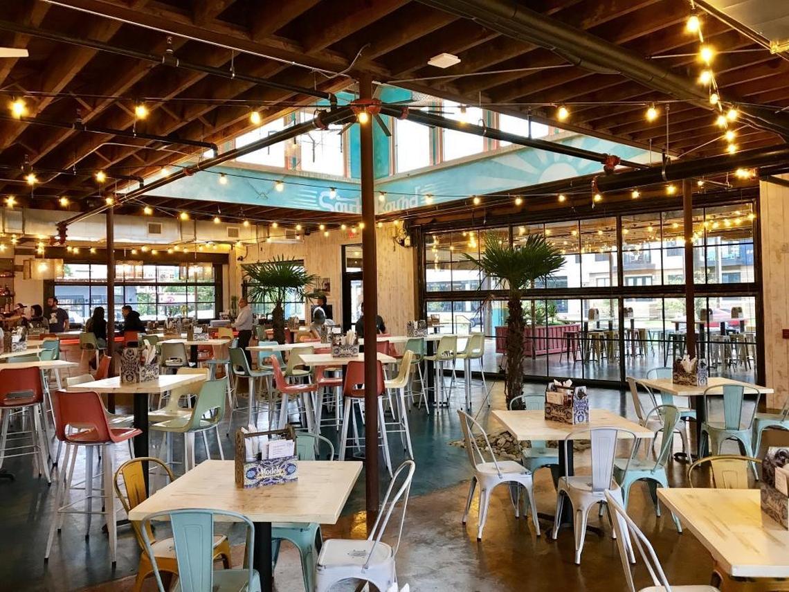 The inside of Southbound is wide open, with hanging lights stretching from booths on one side to the bar on the other.