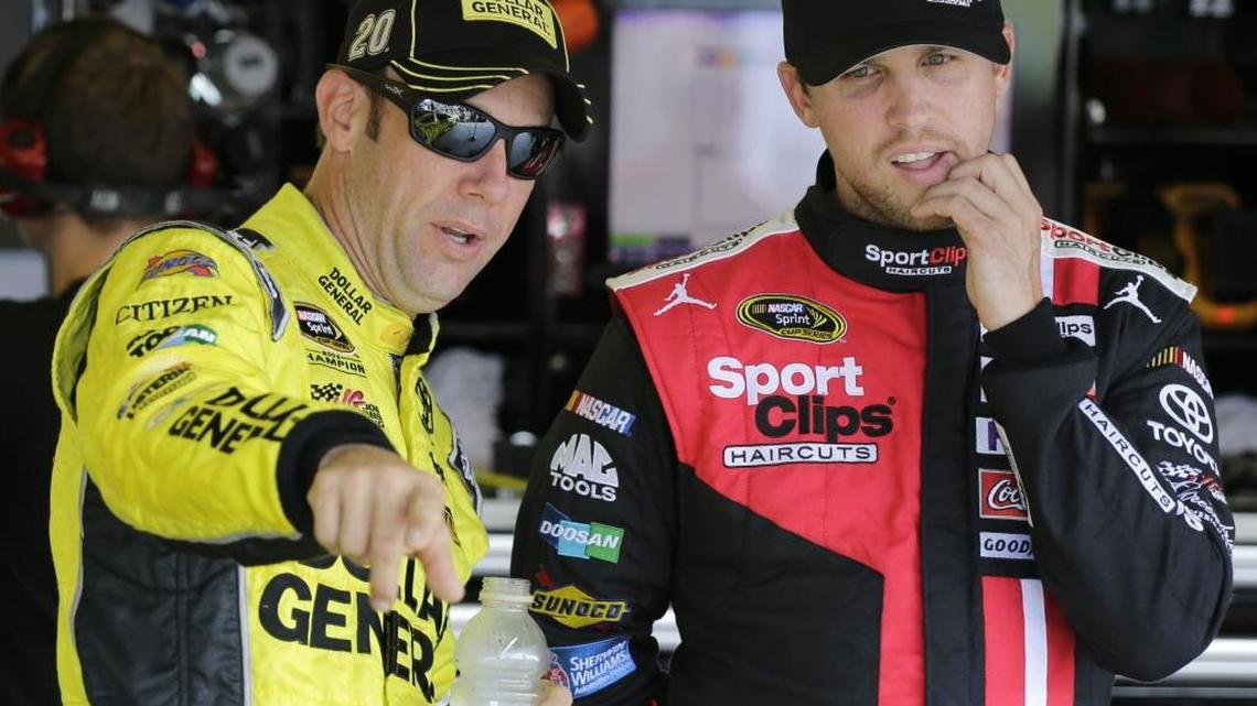 
Matt Kenseth, left, talks with Denny Hamlin before a NASCAR Sprint Cup practice session at Darlington Raceway in Darlington, S.C., earlier this month. 
