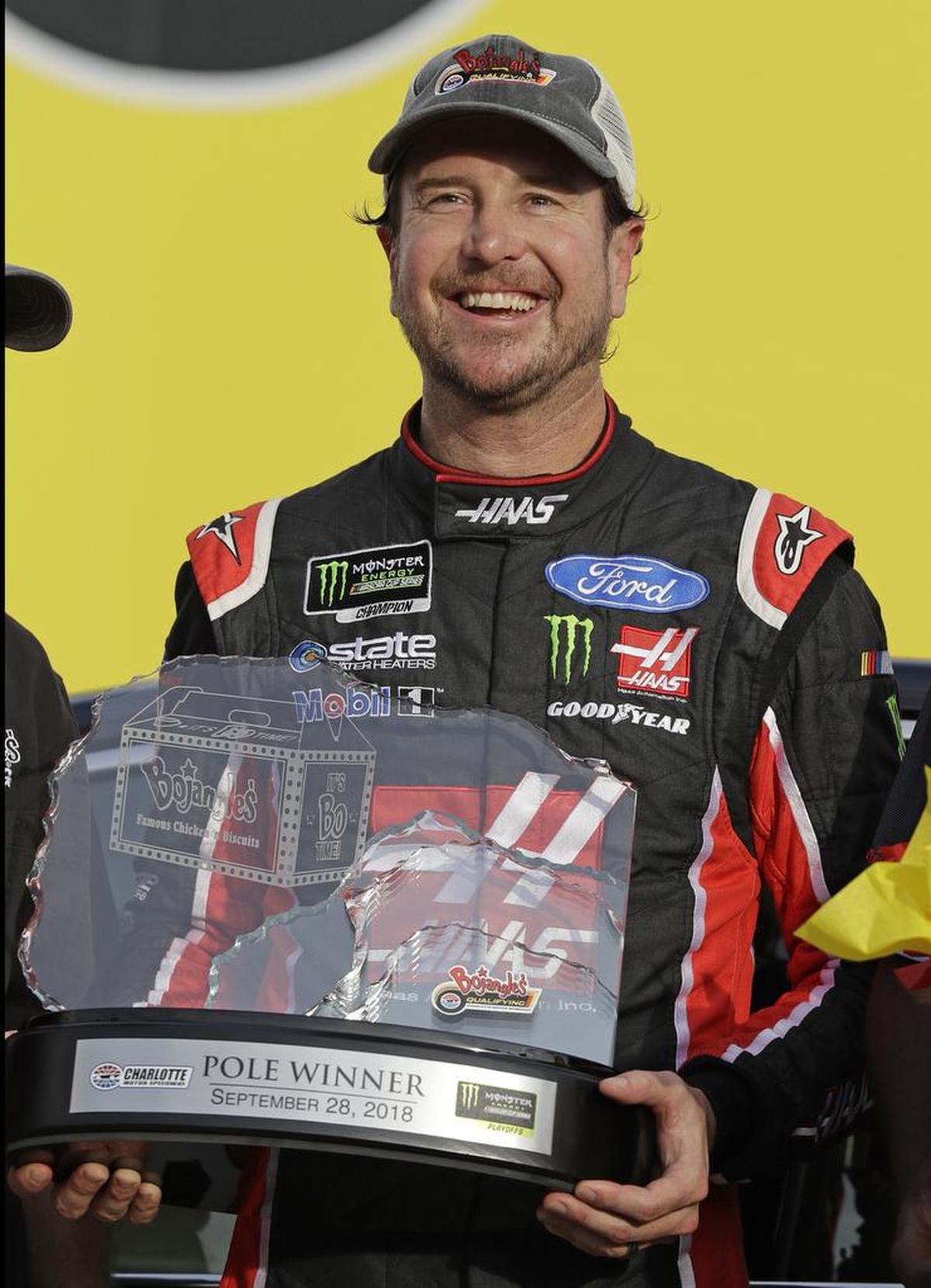 Kurt Busch poses with the trophy in Victory Lane on Friday after winning the pole position for Sunday’s Bank of America ROVAL 400 at Charlotte Motor Speedway.
