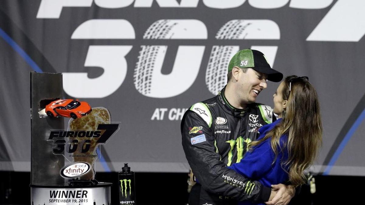 
Kyle Busch, left, smiles as he talks with his wife Samantha Busch in Victory Lane after winning Saturday’s NASCAR Xfinity series auto race at Chicagoland Speedway in Joliet, Ill. This is his fourth victory and eighth top-10 finish in 12 races at Chicagoland Speedway. 
