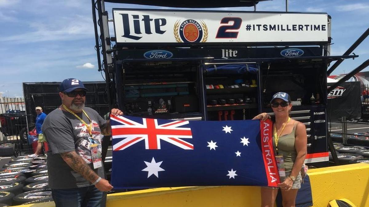 Australians Neville, left, and Wendy Trollip traveled more than 9,000 miles from Perth to root on their favorite driver, Brad Keselowski, at Charlotte Motor Speedway Sunday.