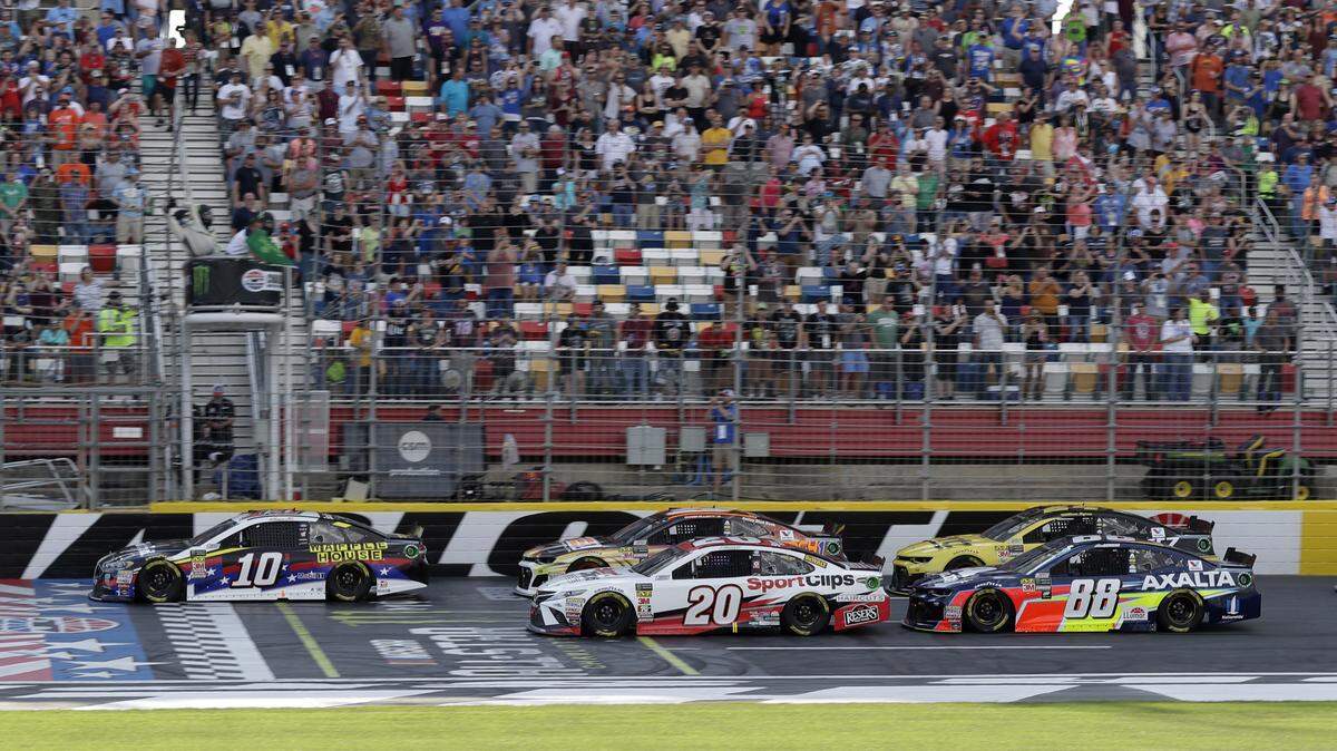 Aric Almirola (10) leads the field at the start of the NASCAR Open auto race at Charlotte Motor Speedway in Concord, N.C., Saturday, May 19, 2018. (AP Photo/Chuck Burton)