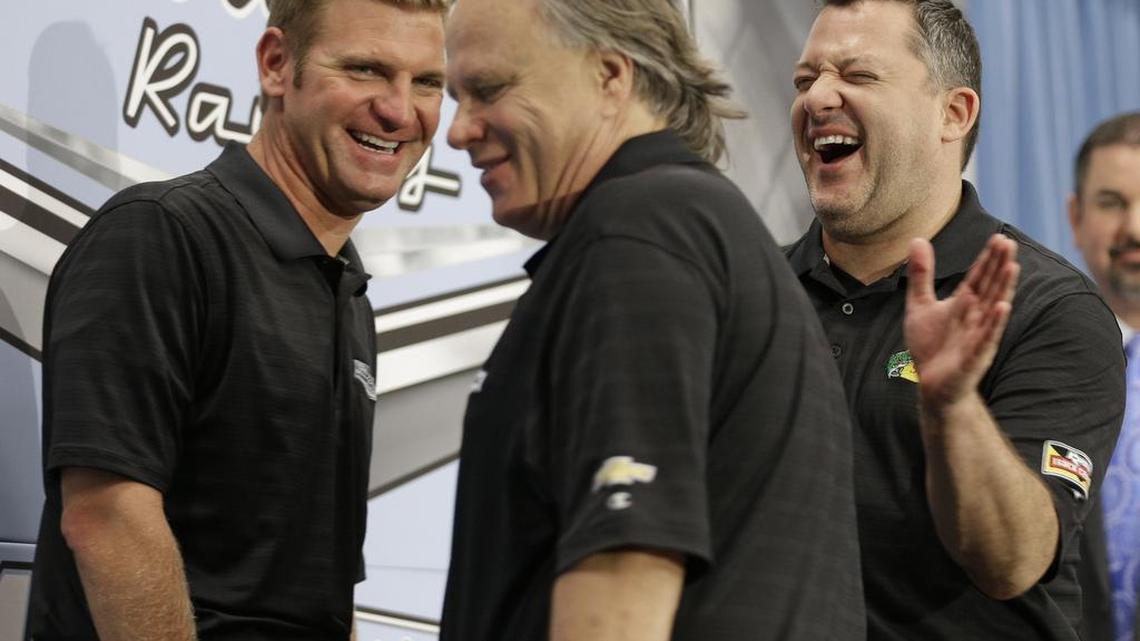 
Tony Stewart, right, shares a laugh with team co-owner Gene Haas, center, and Clint Bowyer, left, as they leave a news conference on Stewart's retirement from driving NASCAR Sprint Cup series racing after the 2016 season at Stewart-Haas Racing's headquarters in Kannapolis on Wednesday.
