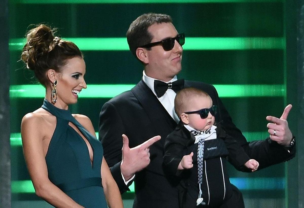 NASCAR Cup Series champion Kyle Busch hams it up onstage with wife Samantha and son Brexton during a 2015 NASCAR awards show in Las Vegas.