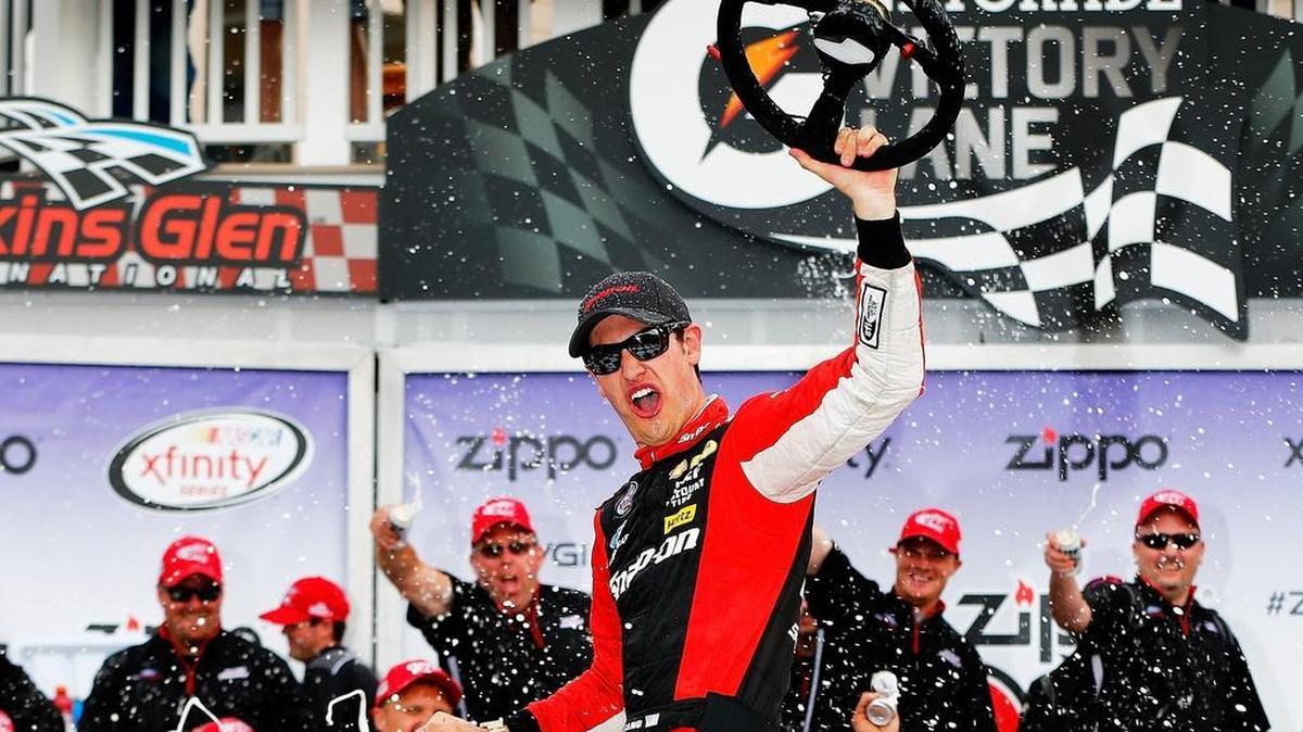 
Joey Logano celebrates after winning his first road-course race at Watkins Glen International.
