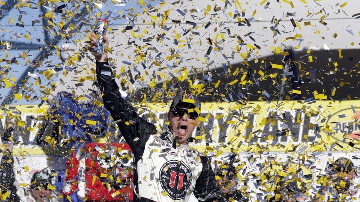 Kevin Harvick celebrates after winning Sunday’s NASCAR Cup Series race at Las Vegas Motor Speedway. It was his second straight Cup win and 100th career win across the three national series.