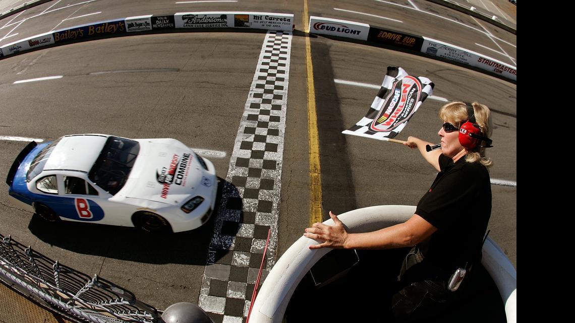 
Driver Joe Henderson takes the checkered flag after his qualifying lap during the NASCAR Drive for Diversity combine at South Boston Speedway October 15, 2007 in South Boston, Va.

