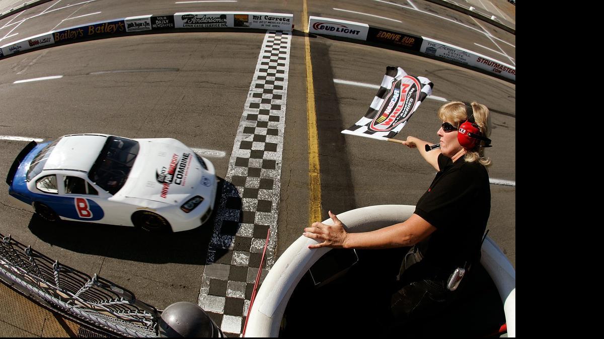 
Driver Joe Henderson takes the checkered flag after his qualifying lap during the NASCAR Drive for Diversity combine at South Boston Speedway October 15, 2007 in South Boston, Va.

