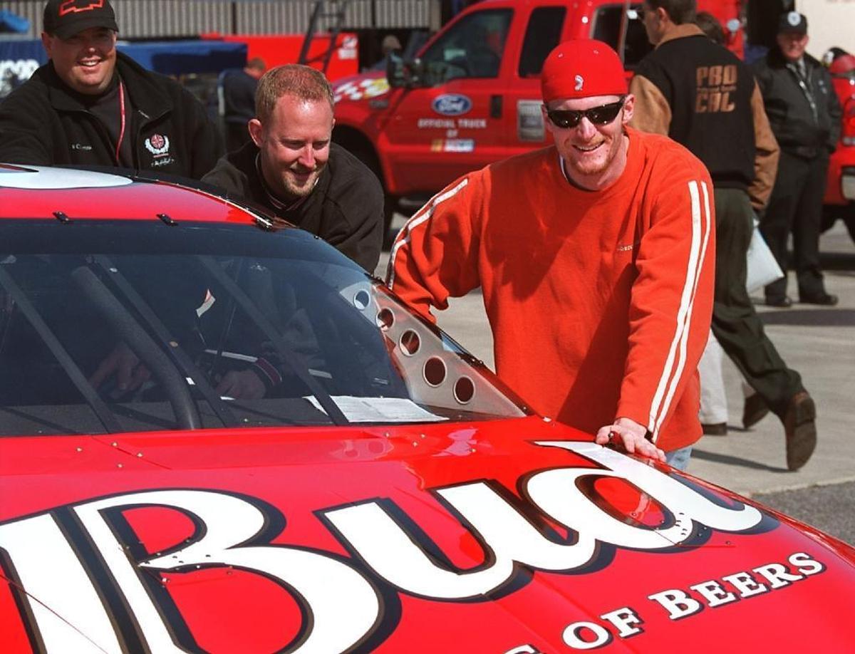 Dale Earnhardt Jr. and members of his No. 8 Chevrolet team fill the car with gas and pushed it into position to be inspected in the Winston Cup garage area at North Carolina Speedway near Rockingham on Feb. 23, 2001.
