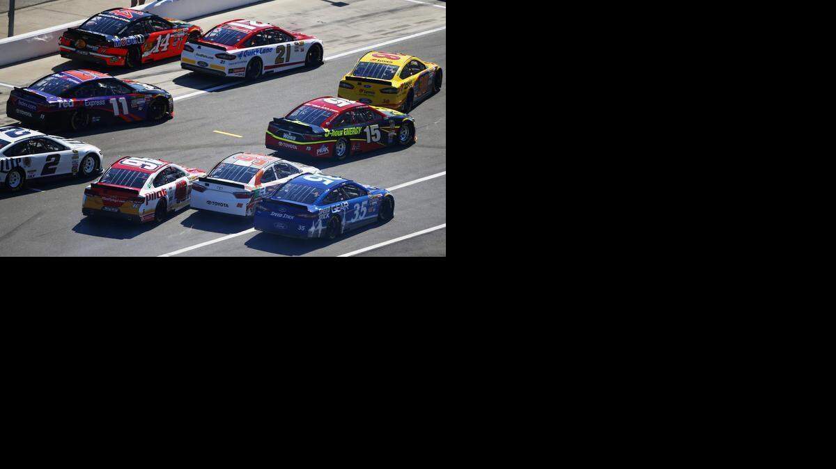 
Cars crowd pit road at the start of qualifying for the 57th Annual Daytona 500 at Daytona International Speedway on Sunday in Daytona Beach, Fla. After complaints, NASCAR altered the qualifying procedure to eliminate the practice. 
