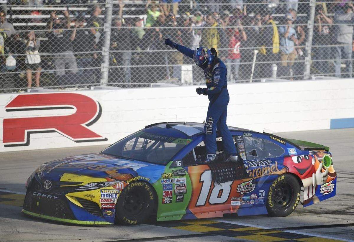 Kyle Busch has won back-to-back races and risen to second place in the NASCAR Cup Series standings ahead of Sunday’s Bank of America 500 at at Charlotte Motor Speedway. Above, Busch celebrates last week’s win at Dover International Speedway.
