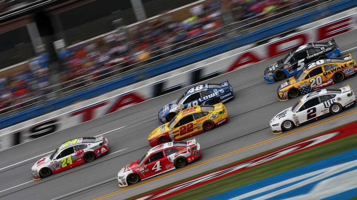 Jeff Gordon (24) leads a pack of cars during Sunday’s NASCAR Sprint Cup Series CampingWorld.com 500 at Talladega Superspeedway in Talladega, Ala.