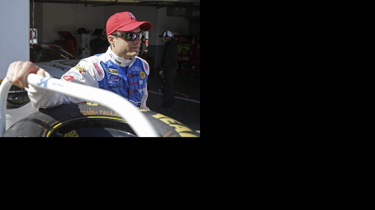 
David Ragan waits outside his garage for the start of a practice session for the Daytona 500  on Feb. 18. 
