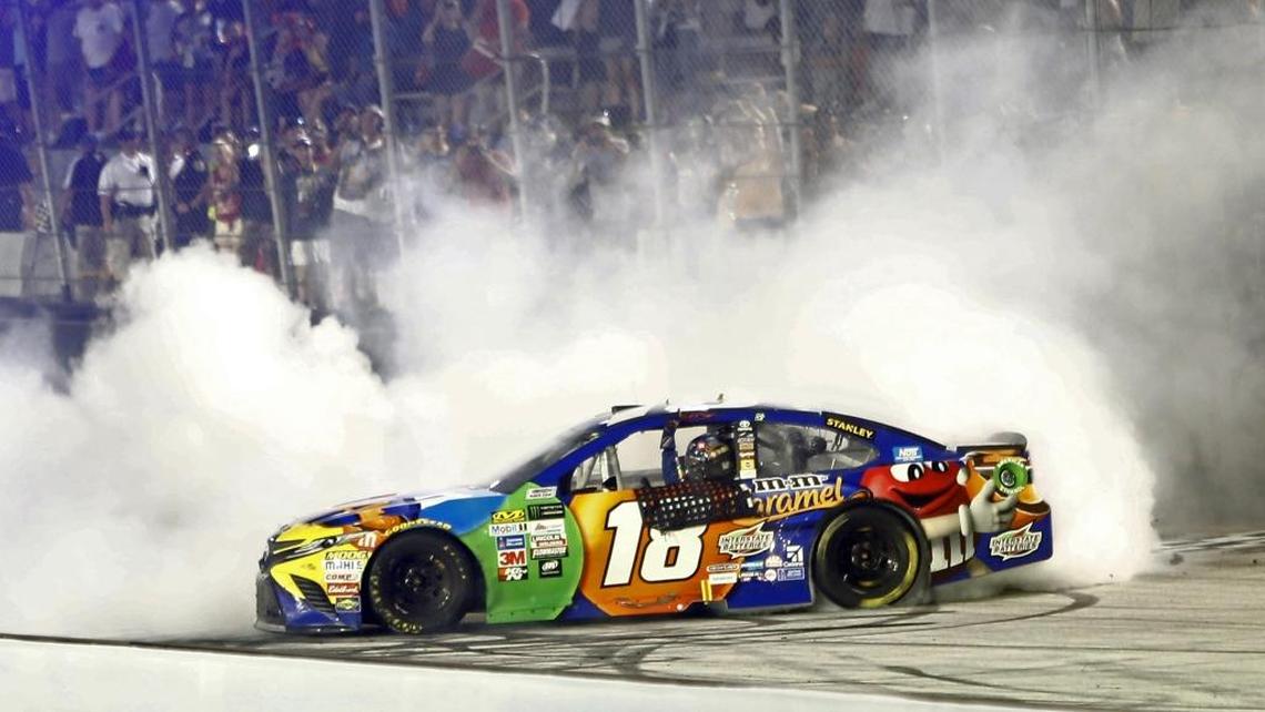 Kyle Busch does a burnout after winning Saturday’s NASCAR Cup Series auto race in Bristol, Tenn.
