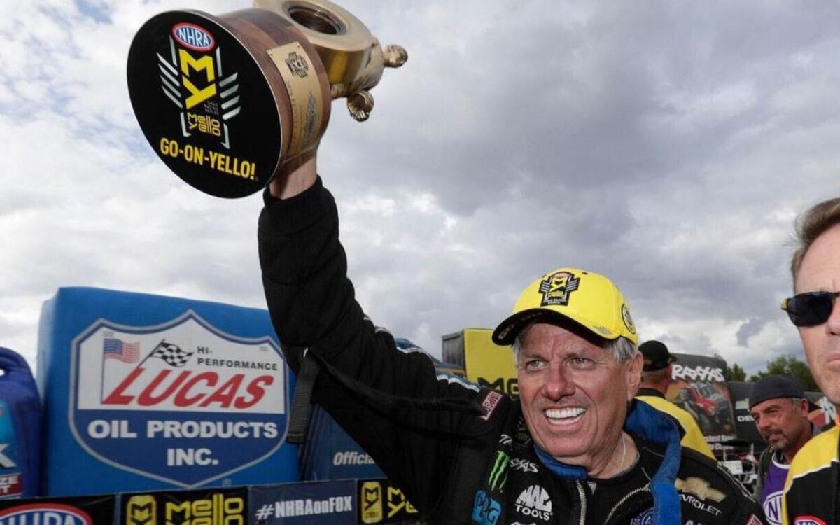 NHRA Funny Car driver John Force hoists his first-ever NHRA Carolina Nationals Wally following a win at zMAX Dragway on Sunday.