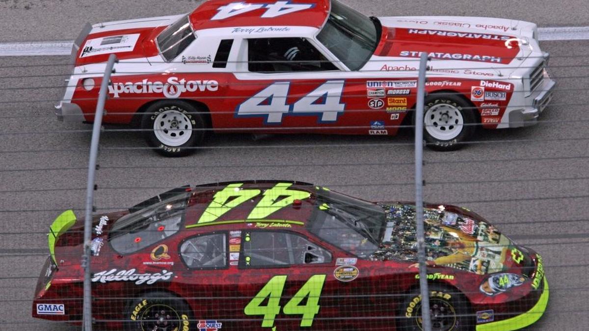 
NASCAR Nextel Cup Series drivers compete in the 2006 Dickies 500 at Texas Motor Speedway in Fort Worth. NASCAR veteran Terry Labonte (44), bottom, rounds the track with his son, Justin Labonte, driving the car that Terry won his first race in 1980 during the parade lap at Texas Motor Speedway. The pair led the starting field during several parade laps prior to Labante's last race at Texas Motor Speedway. 
