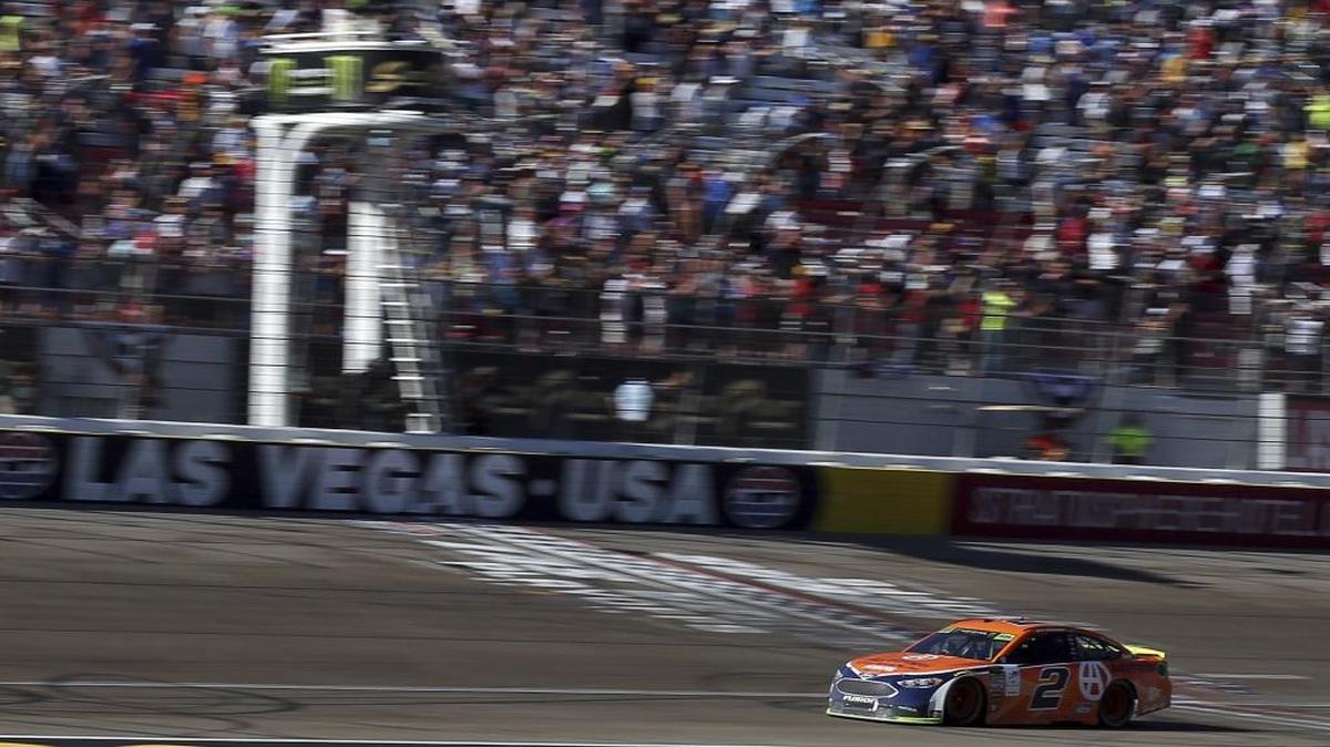Brad Keselowski takes the checkered flag to win the NASCAR Cup Series playoff race at Las Vegas Motor Speedway on Sunday.