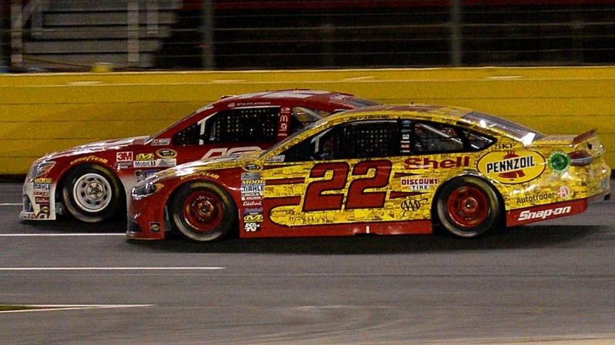 Eventual winner Joey Logano, right, catches Kyle Larson heading into Turn 1 of Charlotte Motor Speedway during the NASCAR Sprint All-Star Race on Saturday.