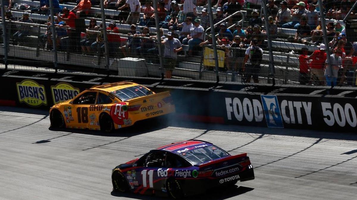 Kyle Busch’s No. 18 Toyota slaps the Turn 2 wall one of three times during Sunday’s Food City 500 at Bristol Motor Speedway.