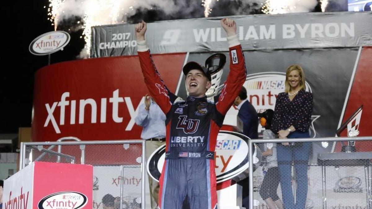 William Byron celebrates in Victory Lane after clinching the NASCAR Xfinity Series championship Saturday at Homestead-Miami Speedway in Homestead, Fla. Cole Custer won the series’ season finale.