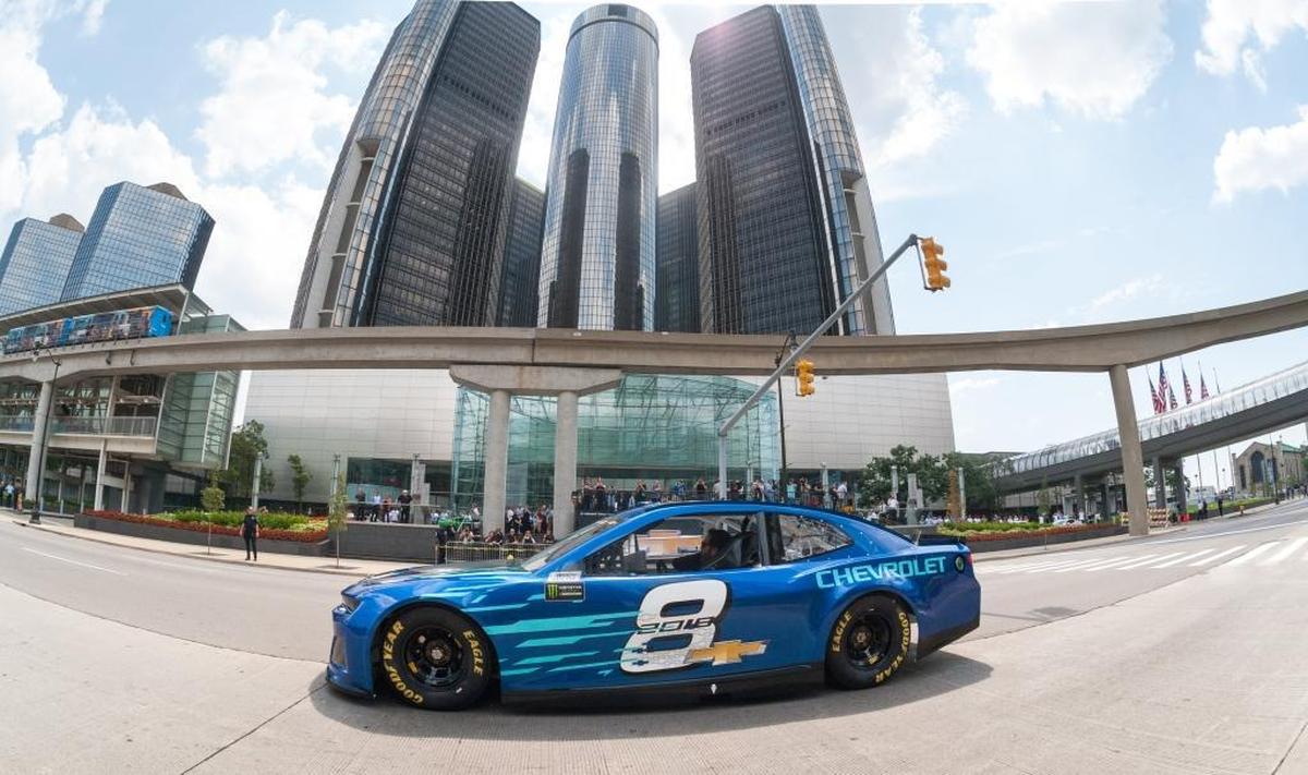 Seven-time NASCAR Cup Series champion Jimmie Johnson drives the 2018 Chevrolet Camaro ZL1 race car up Jefferson Avenue in front of the General Motors Renaissance Center Global Headquarters in Detroit in August.