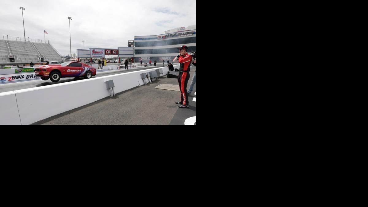 
Joey Logano and Cruz Pedregon took turns driving a Cobra Jet Mustang, used in the NHRA Top Sportsman class, down the quarter-mile dragstrip at zMax Dragway in Concord on Wednesday, March 25, 2015.


