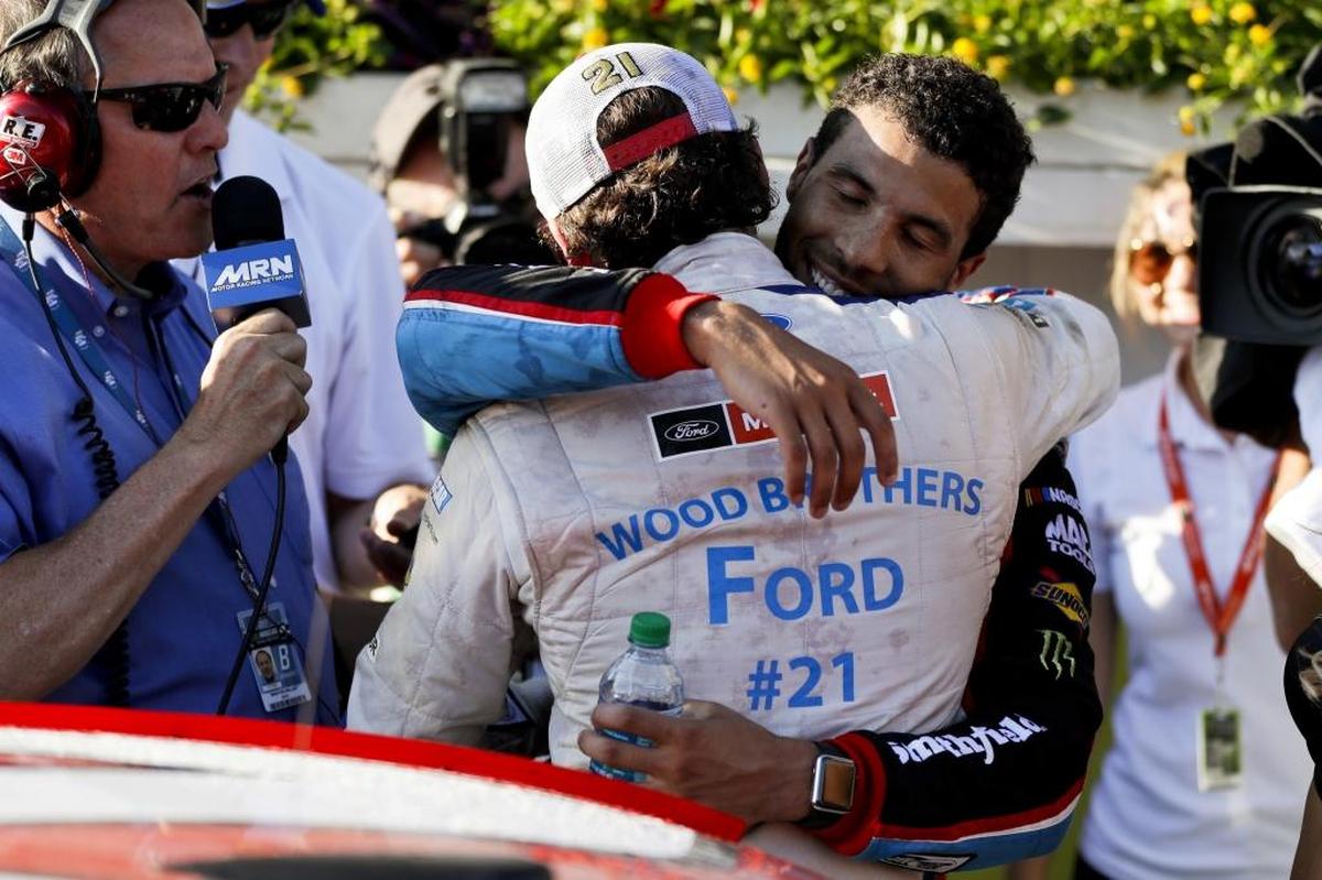 Darrell Wallace Jr., right, greets Ryan Blaney in Victory Lane after Blaney won Sunday’s NASCAR Cup Series Pocono 400 auto race in Long Pond, Pa.