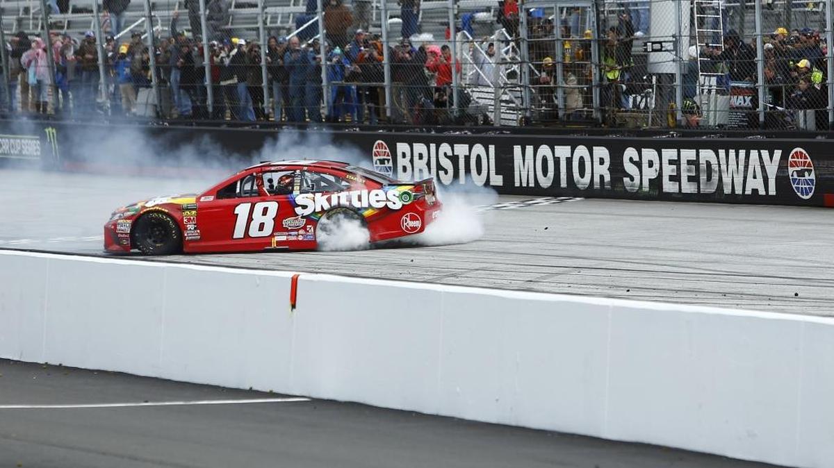 Kyle Busch does a burnout after winning Monday’s NASCAR Cup Series race at Bristol Motor Speedway.