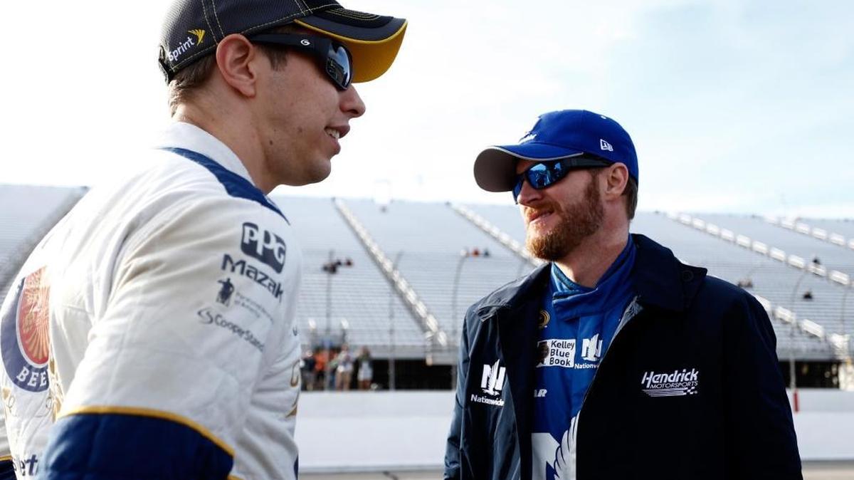 
Brad Keselowski, left,  speaks with Dale Earnhardt Jr. last week. Keselowski was penalized during last week’s race at New Hampshire for jumping the restart.


