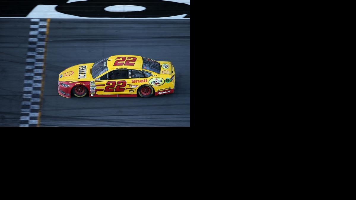 
Joey Logano, driver of the #22 Shell Pennzoil Ford, takes the checkered flag to win the NASCAR Sprint Cup Series 57th Annual Daytona 500 at Daytona International Speedway on February 22, 2015 in Daytona Beach, Florida. 

