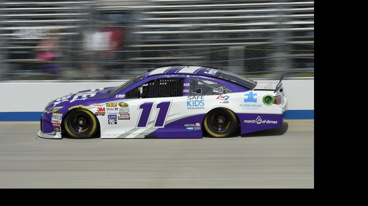 
Denny Hamlin drives his car during qualifying for Sunday's NASCAR Sprint Cup series auto race, Friday, May 29, 2015, at Dover International Speedway in Dover, Del. Hamlin won the pole. 
